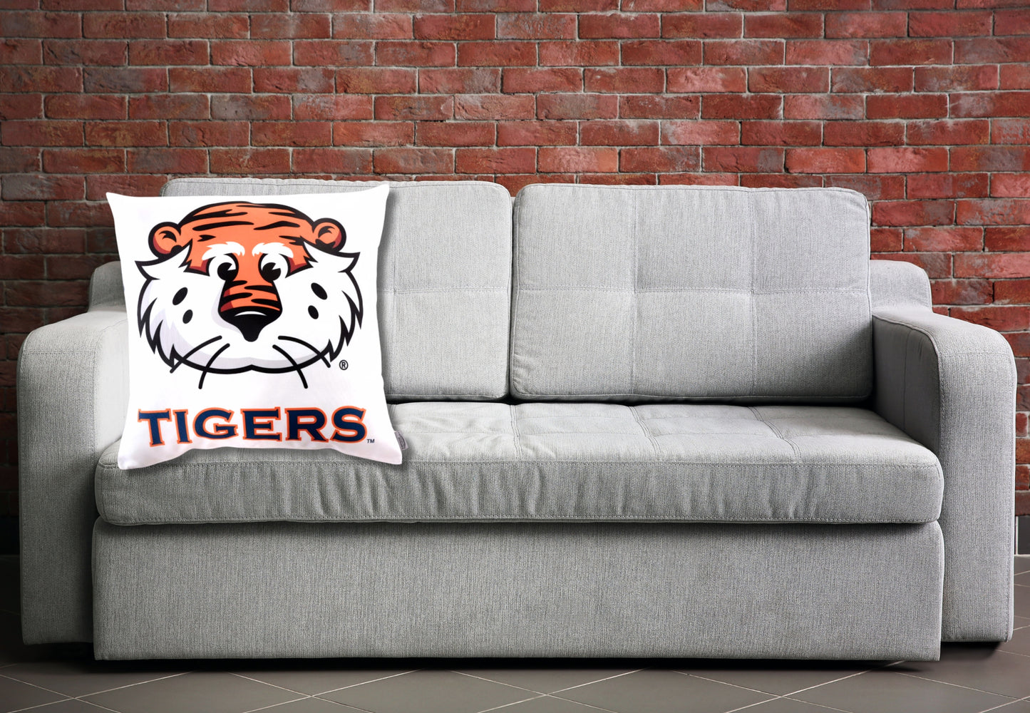 Aubie Tiger Throw pillow on a sofa