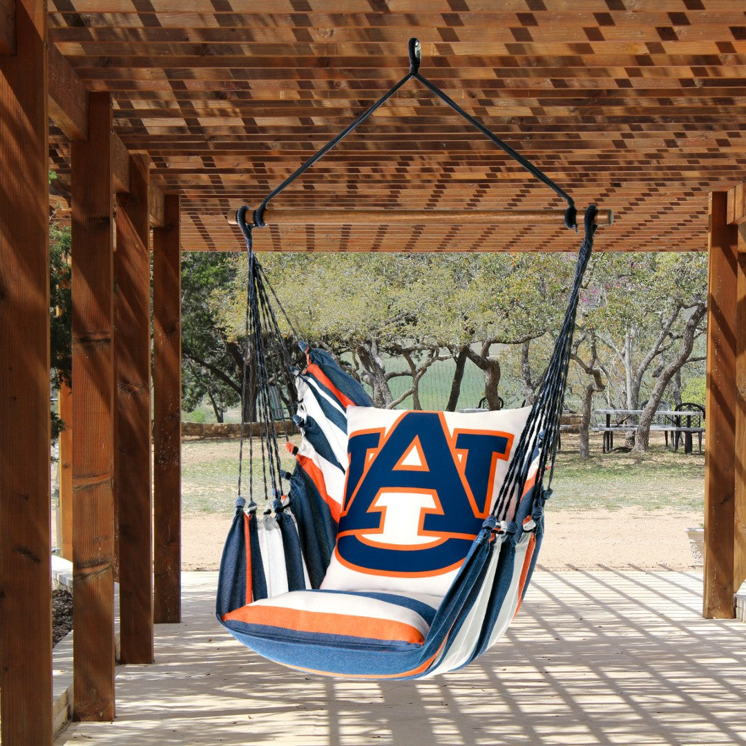 Hanging hammock chair with Auburn University logo on a wooden deck