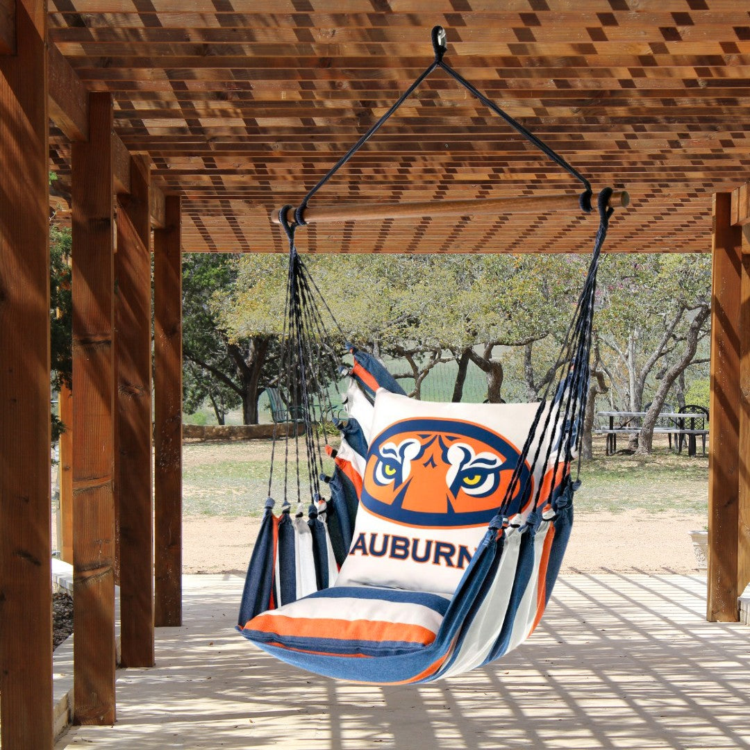 Hanging hammock chair with Auburn University Tiger Eyes logo on a wooden patio deck outdoors
