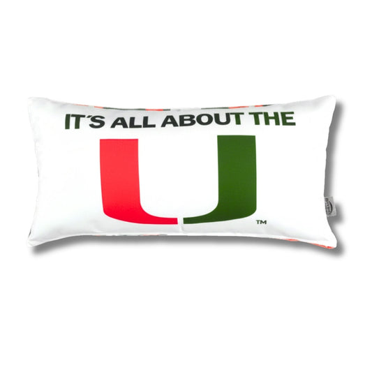 Pillow with 'It's All About the U' text and logo on a white background