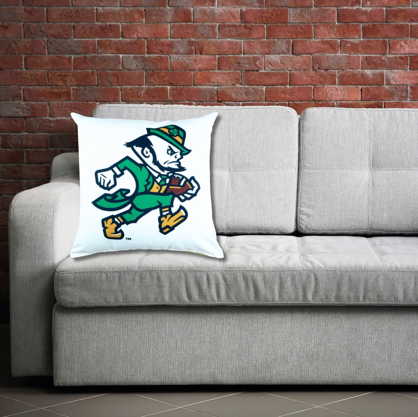 Notre Dame Football Pillow Cover on a gray sofa