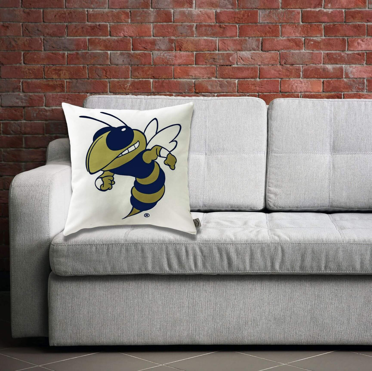 Yellow Jackets Buzz pillow displayed with sofa decor