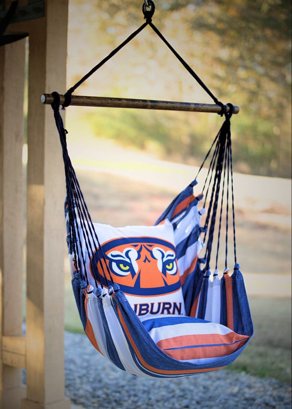 Hammock chair with Auburn University logo hanging outdoors.
