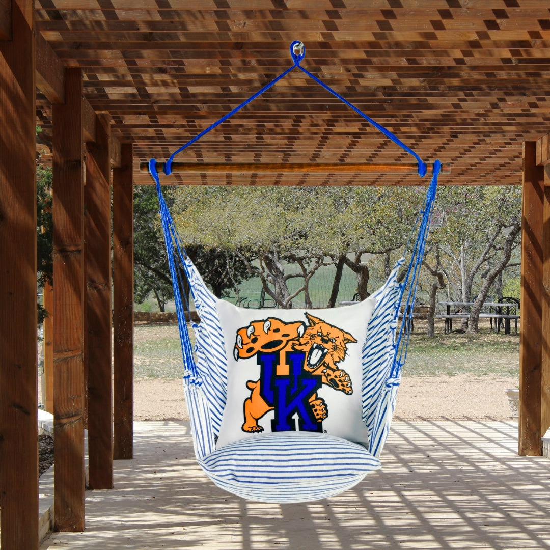Hanging chair with a UK Wildcat mascot logo on a wooden deck