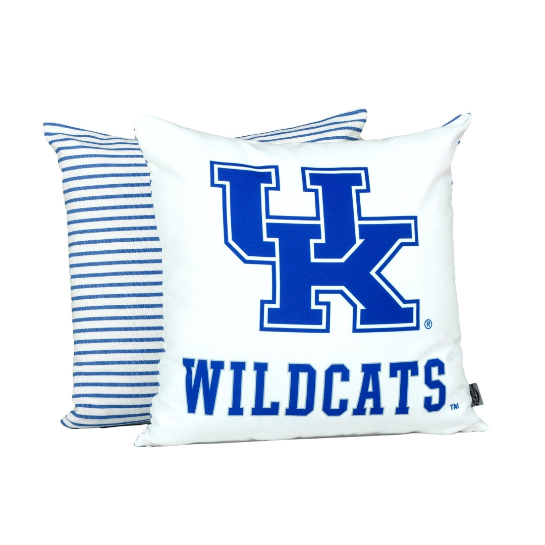 White pillow with blue 'UK' and 'WILDCATS' text, next to a striped pillow on a white background