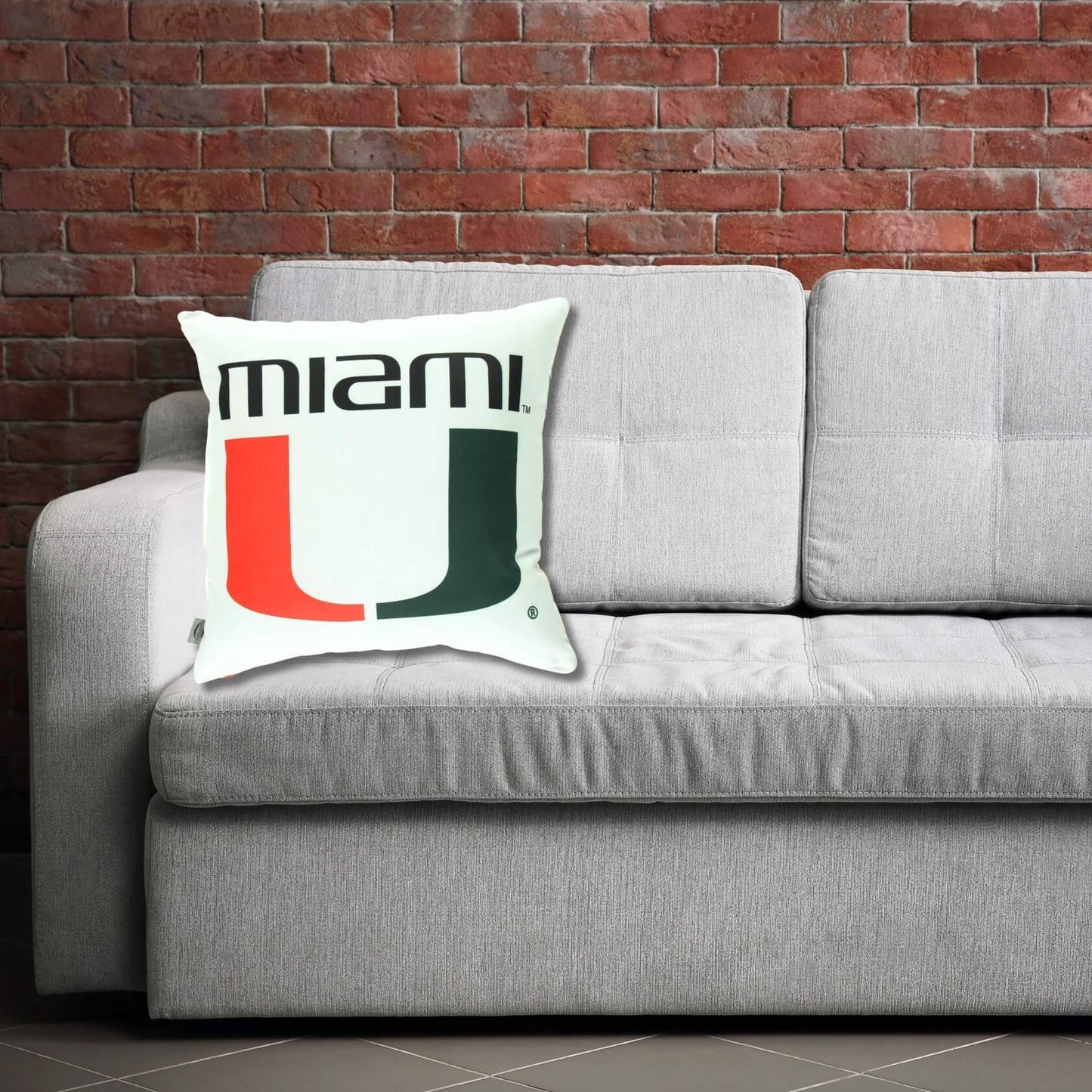 miami hurricanes pillow cushion on a sofa