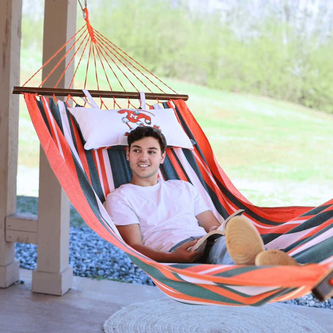 Man relaxing on a University of Miami Hammock Outdoors