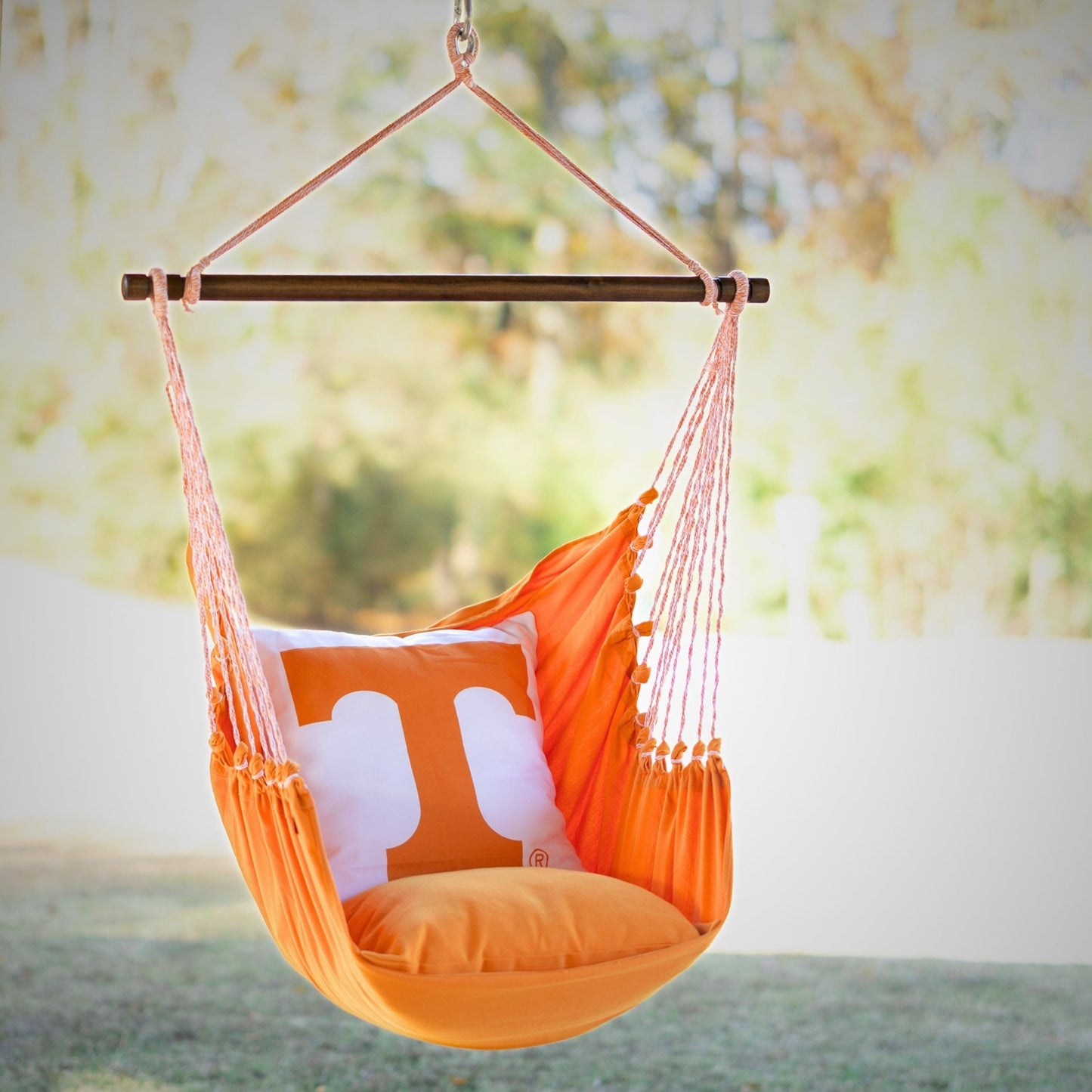 Orange Tennessee Volunteers hammock chair with a pillow on a blurred outdoor background