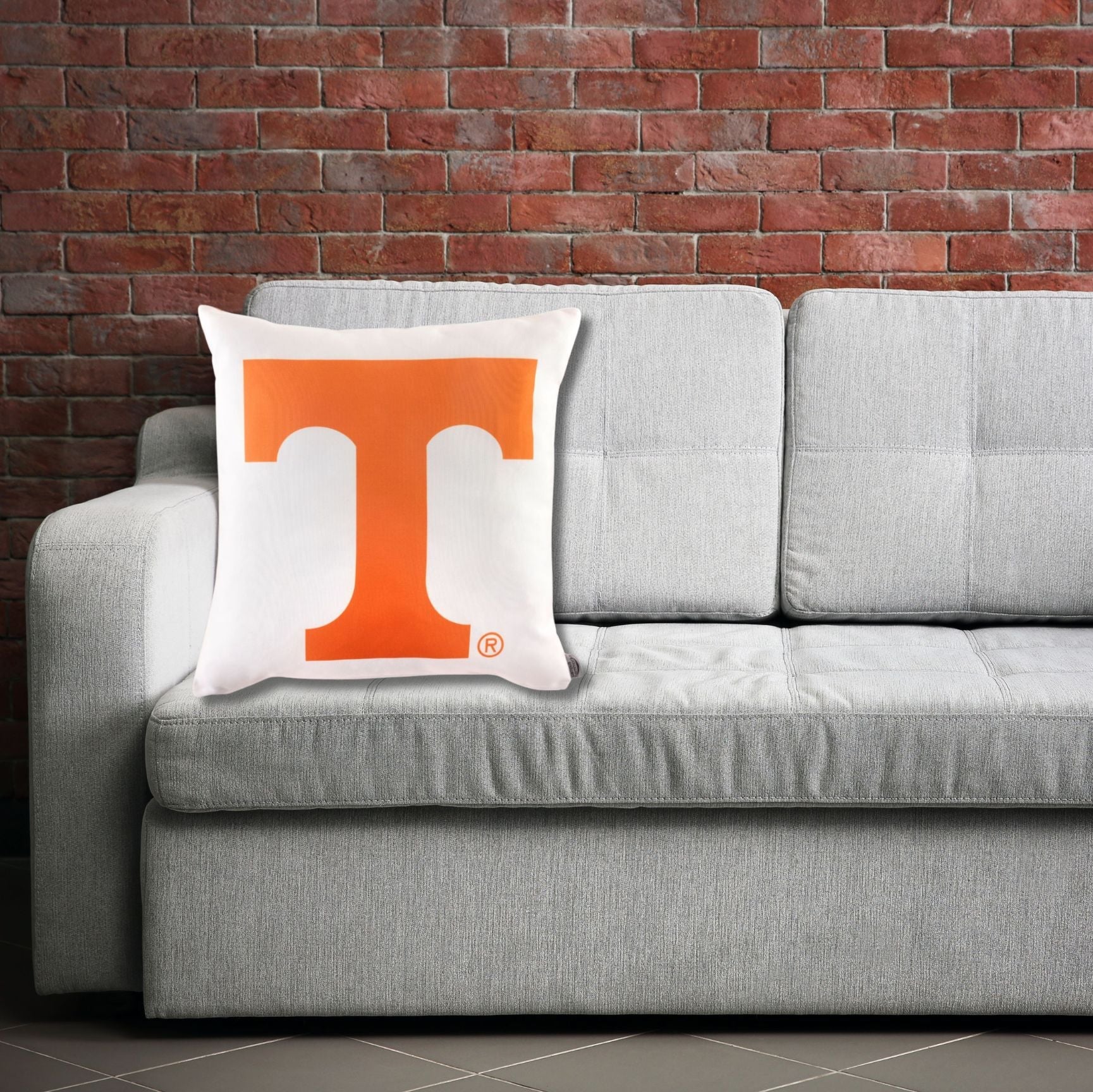 Tennessee Vols Logo Pillow on a sofa indoors a fan cave for room decor