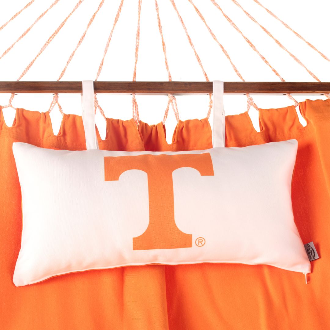 White pillow with orange Tennessee Power 'T' logo on an orange hammock